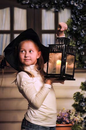 Girl with lanterns in witch hat