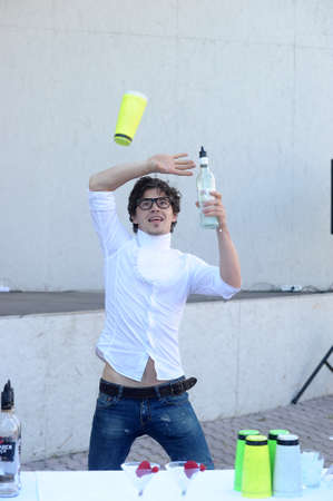 Show the bartender pours drinks tossing bottles and glasses, St. Petersburg, Russia.のeditorial素材