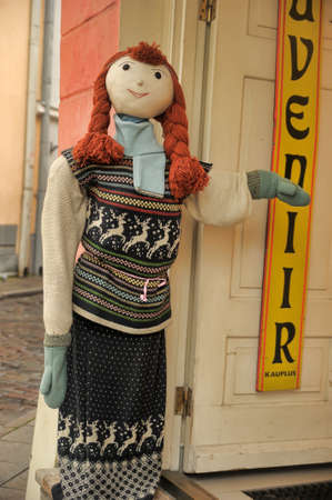 Big doll invites you to go to the gift shop, Tallinn, Estiona.のeditorial素材