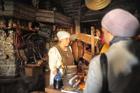 Retro portrait in old style of beautiful girl on the street of old Tallinn.のeditorial素材