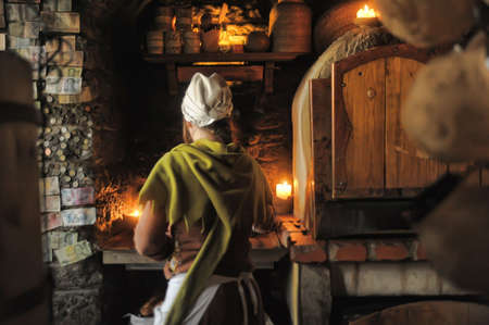 Retro portrait in old style of beautiful girl on the street of old Tallinn.のeditorial素材