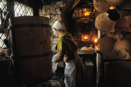 Retro portrait in old style of beautiful girl on the street of old Tallinn.のeditorial素材