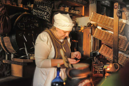 Retro portrait in old style of beautiful girl on the street of old Tallinn.のeditorial素材