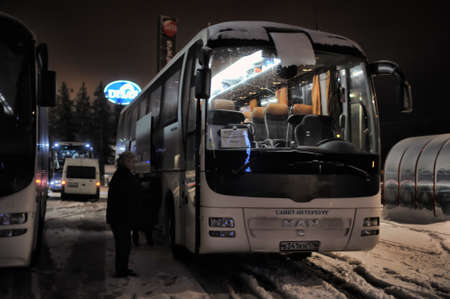 Tourist buses in a parking lot in the winter, Imatra, Finland.のeditorial素材