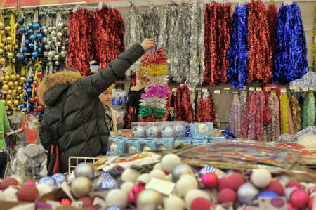 People in the store to buy Christmas decorations for the house Auchan, St. Petersburg, Russia.のeditorial素材