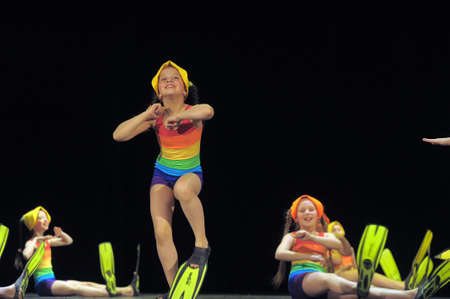 Children in bathing suits and flippers dancing on stage, the performance of children's dancing collectives, St. Petersburg, Russia.のeditorial素材