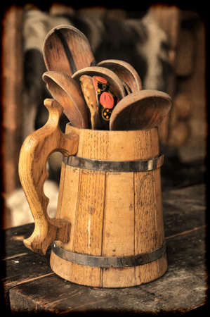 wooden spoons in a wooden mugの写真素材