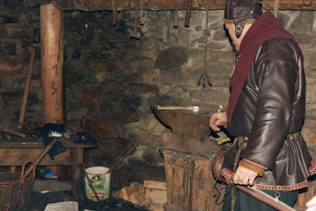 Viking in the smithy, Homesteads Viking Age, Center for History and Culture, the so-called yard Vikings Svargas, Russia.のeditorial素材