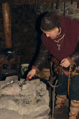 Viking in the smithy, Homesteads Viking Age, Center for History and Culture, the so-called yard Vikings Svargas, Russia.のeditorial素材