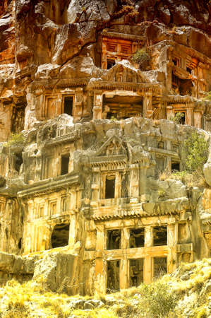 Tombs carved into the rocks in the town of Demre.の写真素材