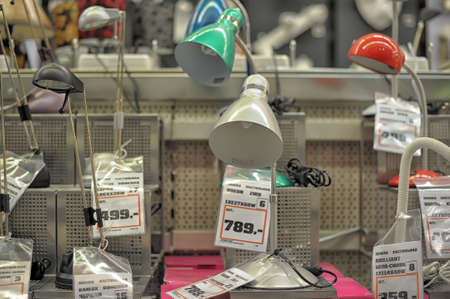 Home and office lighting products are displayed on the shelves in a hardware store.のeditorial素材