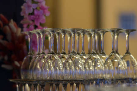 Hanging wineglasses, selective focus, lot of color reflections and chromatic aberrations left...