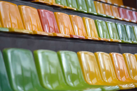 Multicolored seats in the stadium.