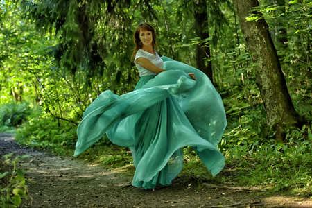 Beauty woman with dress flyingの写真素材