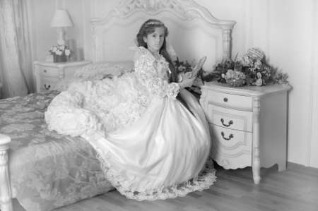 Princess in a white dress retro child.の写真素材