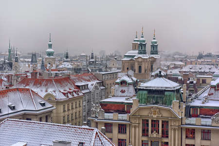 Wintry snow covered historic roofs of Prague, Czech republic.のeditorial素材