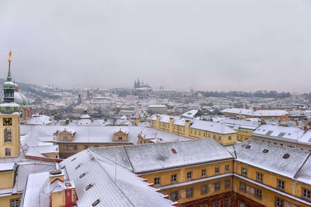 Wintry snow covered historic roofs of Prague, Czech republic.のeditorial素材