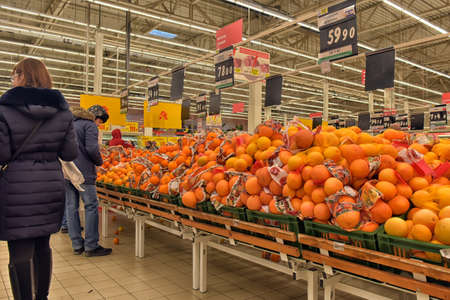 People in the supermarket to buy fruits and vegetables, St. Petersburg, Russia.のeditorial素材