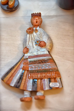 The girl in the Lithuanian suit.Historical clothes. ceramic doll in a gift shop.の写真素材