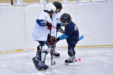 Children playing hockey on a city tournament St. Petersburg, Russia.のeditorial素材