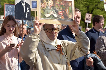 St.PETERSBURG, RUSSIA - MAY 9, 2016: Participants of Immortal Regiment - public action, during which...