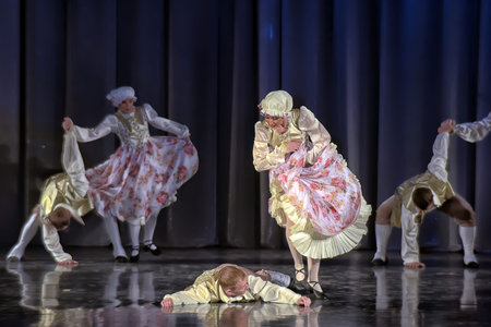 People dancing in traditional costumes on stage, performances dance group, St. Petersburg, Russia.のeditorial素材