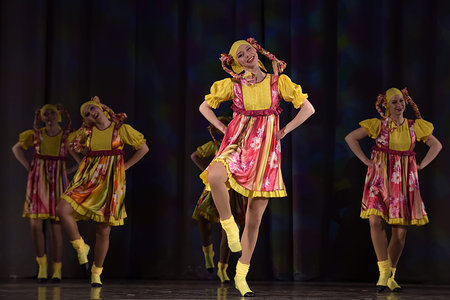 Children's theatrical performance of dance group in national costume, Russia, St. Petersburg.