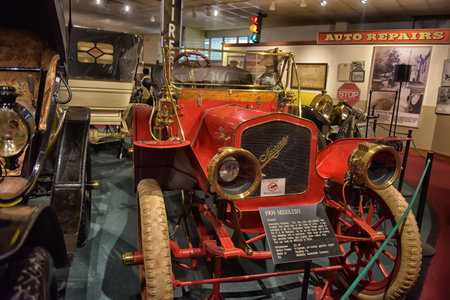 Antique American car in museum around other early twentieth century motorcars. 1910 Maxwell Roadster...