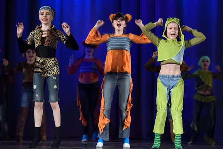 Children dancing on the stage in animal costumesのeditorial素材
