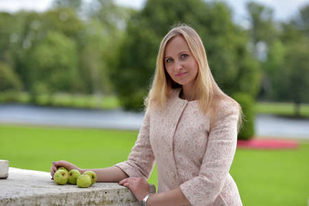 Woman in a light beige coatの写真素材