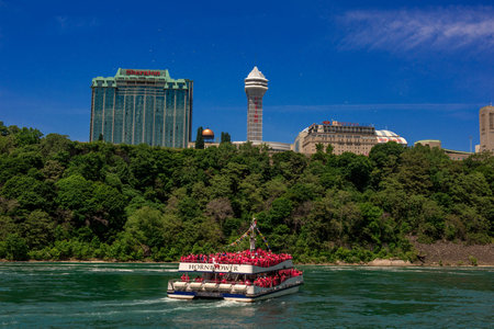People aboard the boat called the Hornblower approaching the American falls and Canadian Horseshoe falls.のeditorial素材