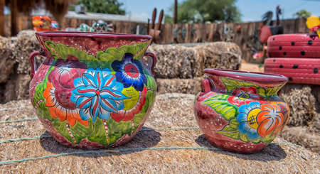 Colorful ceramic pottery with designs from Mexico and on display to be sold in a local market in the artists colony city of Tubac, Arizona, near Tucson.のeditorial素材