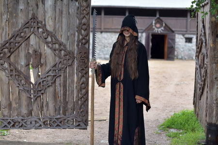 Halloween girl in a raincoat.の写真素材