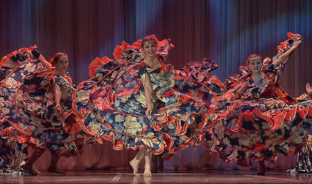 Flamenco dance on stage. Beautiful gypsy dancers performing a traditional dance.のeditorial素材