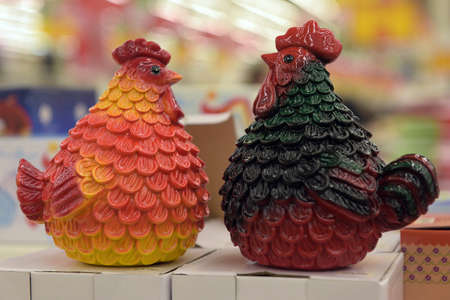 Two ceramic roosterの写真素材