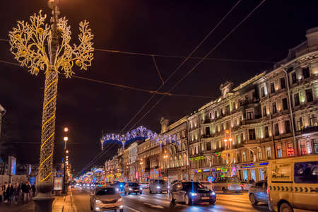 Busy automobile traffic on Nevsky prospect with Christmas lightsのeditorial素材
