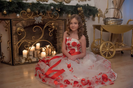 Girl in white dress with red flowersの写真素材