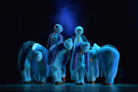Children in a suit of penguins dance on a stage, Children's dance group, Petersburg, Russiaのeditorial素材
