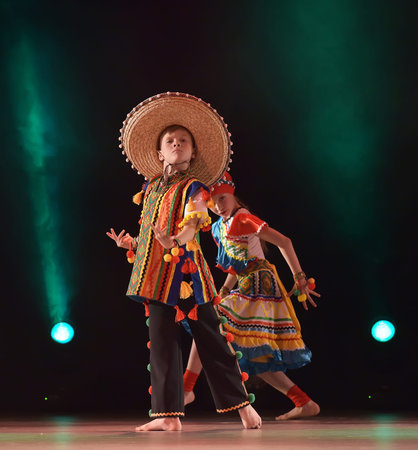 Children in Mexican costumes dance on stage, Theater of Choreographic Miniatures Style, Performance in St. Petersburg, Russiaのeditorial素材