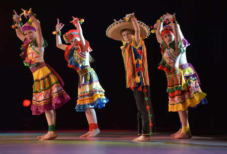 Children in Mexican costumes dance on stage, Theater of Choreographic Miniatures Style, Performance in St. Petersburg, Russiaのeditorial素材