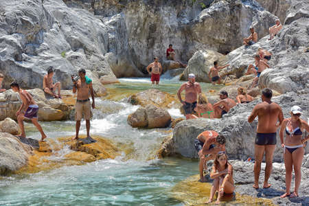 Kemer, Antalya, Turkey - 21.07.2015: A lot of people bathing in a mountain stream canyon Kuzdere during jeep safari on the Taurus mountains.のeditorial素材