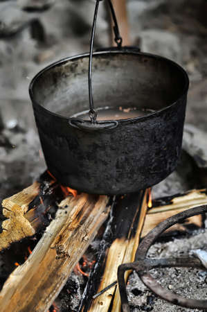 pot of stew over fireの写真素材