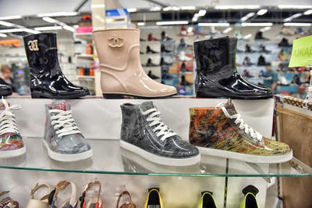 Russia, St. Petersburg 10,09,2017 Rubber boots and shoes in the storeのeditorial素材