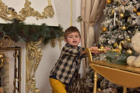 boy in checkered shirt at christmas playsの写真素材