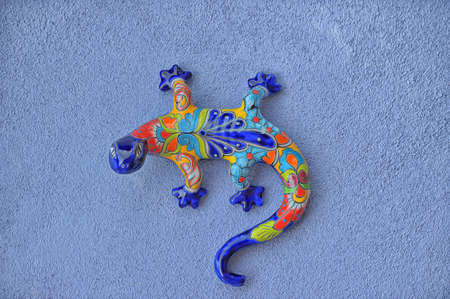 Mexican pottery lizard on the wallの写真素材