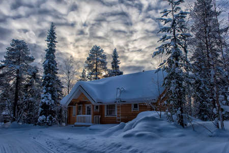 Finland, Salla   25,02,2018  a wooden house in the snow-covered forest  in the Lapland region of Finland.のeditorial素材