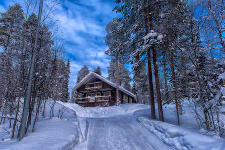 Finland, Salla   25,02,2018  a wooden house in the snow-covered forest  in the Lapland region of Finland.のeditorial素材