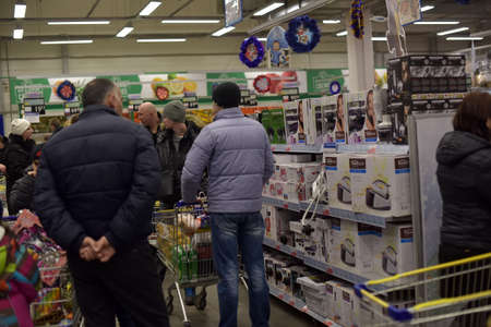 Russia, St.Petersburg 27,12,2015 Unknown buyers in the supermarketのeditorial素材