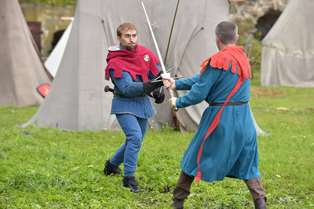 Russia, Ivangorod 01.08,2015 Festival of medieval reconstruction Russian fortress, Fencing on swords...