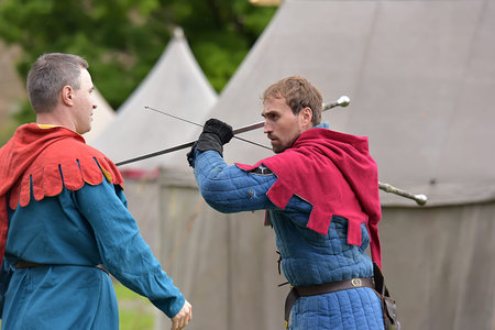 Russia, Ivangorod 01.08,2015 Festival of medieval reconstruction Russian fortress, Fencing on swords...